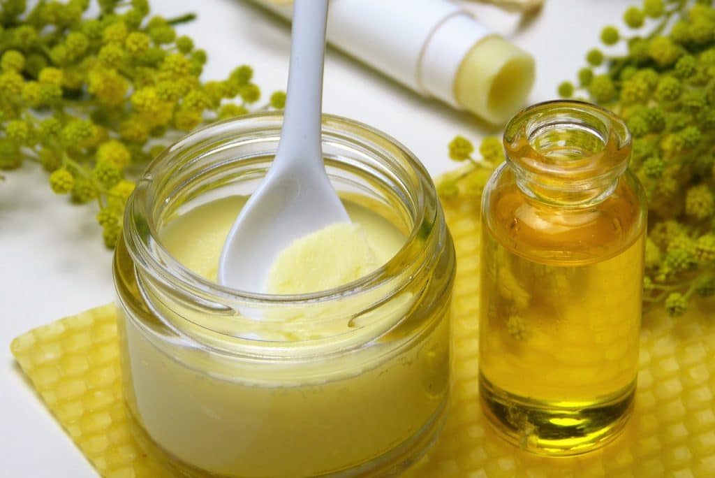 A spoon in a jar of beeswax